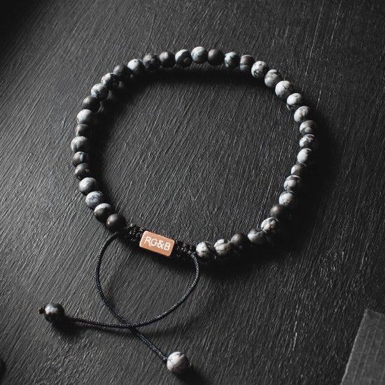 Minimal Snowflake Obsidian Bead Bracelet - Our Minimal Snowflake Bead Bracelet Features Natural Stones, Waxed Cord and Brushed Rose Gold Steel Hardware. A Beautiful Addition to any Collection.